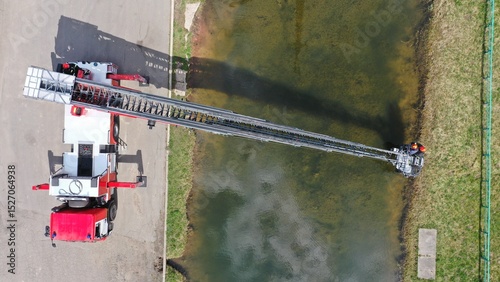 Evacuation of residents of flooded roynes using long fire escape ladder in flood, tsunami