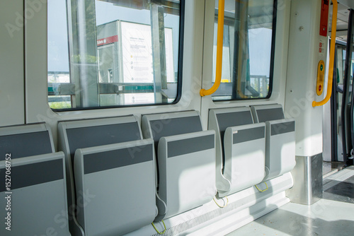 Fototapeta Naklejka Na Ścianę i Meble -  Empty modern metro cabin from inside on the move during the ride. Driverless metropolitan of Copenhagen, Denmark, clean and comfortable mode of transport.