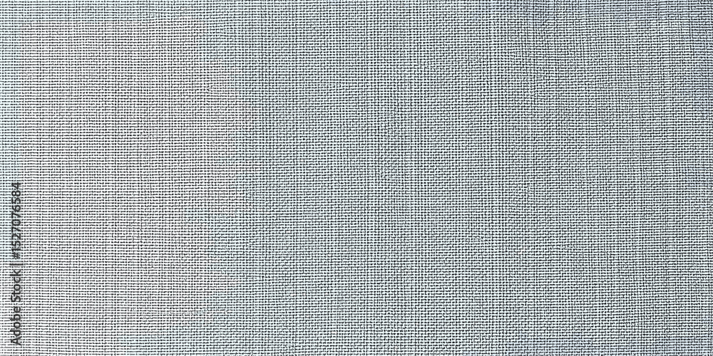 Fototapeta premium Subtle textured fabric in light blue color for backgrounds