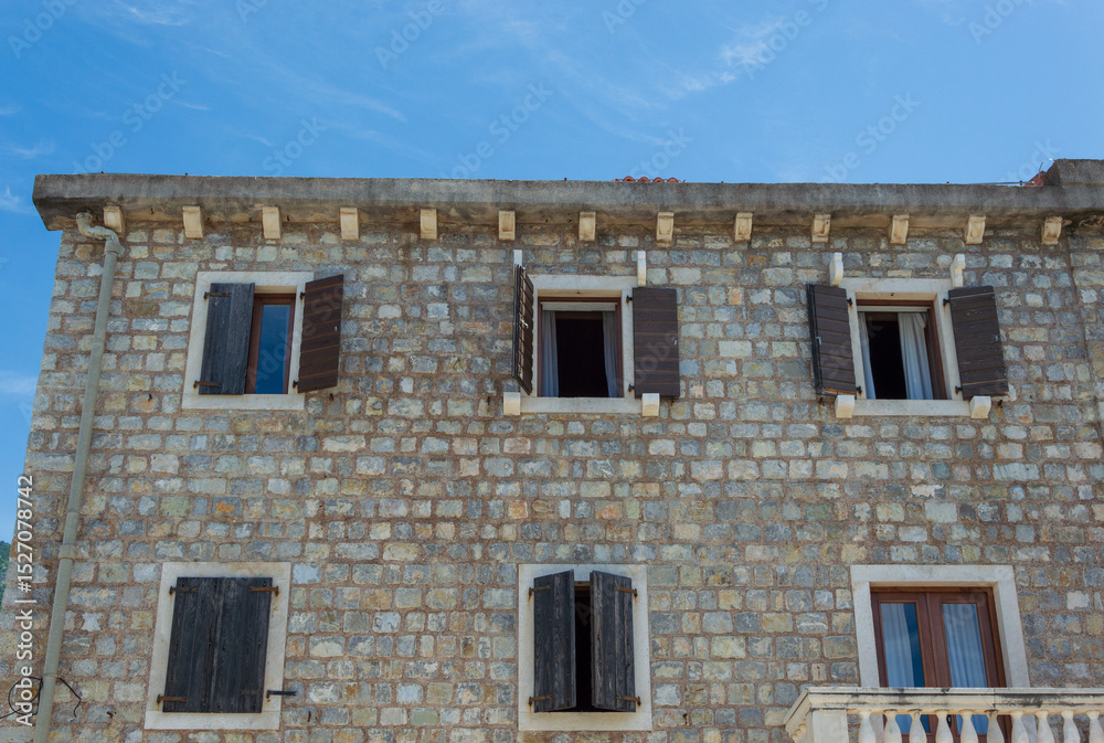 Fototapeta premium Old stone houses in Petrovac Montenegro, a resort town located on the coast of the Adriatic Sea in Montenegro