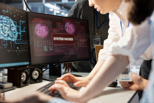 Close up of engineering team reviewing AI systems warnings after detecting irregular network activity patterns. Teamworking colleagues evaluating threats using artificial intelligence detection tools