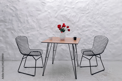 A table and chairs for the kitchen in a modern interior minimalism