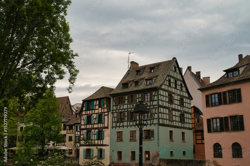 Naklejka premium Romantic half-timbered houses from the 16th and 17th centuries, on the banks of the river III (tributary of the Rhine) in the center of Strasbourg, La petite France.
