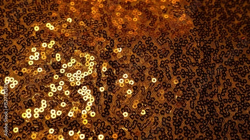 Golden sequins texture.Festive Wallpaper with copy space. New Year and Christmas Festive background. 4k footage