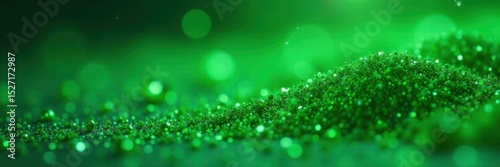 Densely packed green glitter, highly textured surface, close up, shiny