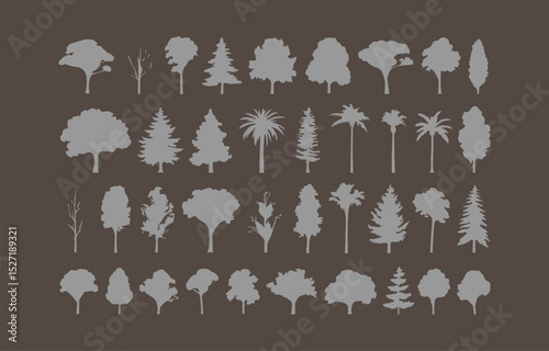 Collection of gray tree silhouettes on dark background