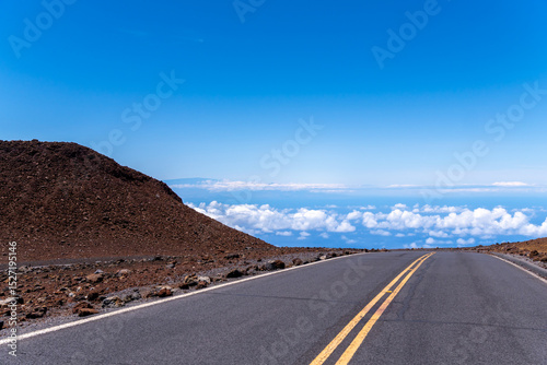 Road to the sky with clouds and blue sky on the island of Maui.