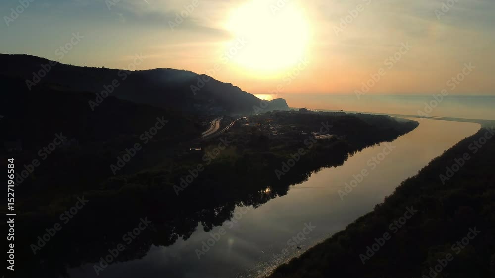 Aerial View of river, Beautiful Aerial View of African Jungles forest and River, Landscape in aerial drone shot. Adove calm tranquil river in Jijel Algeria North Africa, River and green fores trees.