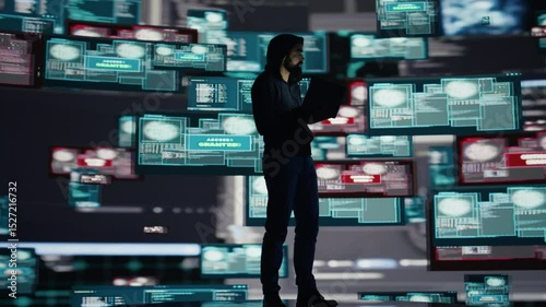 Conceptual representation of cyber crime with male hacker exploiting system vulnerability, using programming technique and surveillance to override digital defenses and leak information. Camera B.