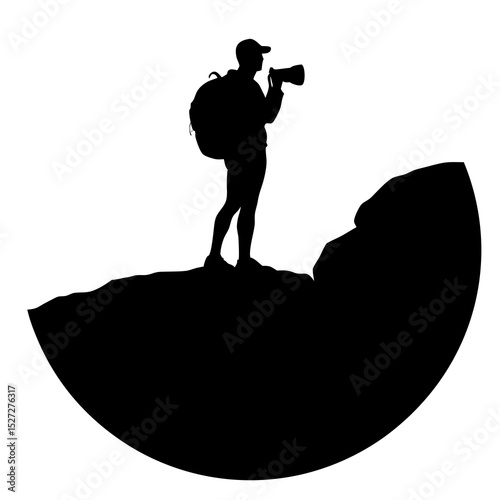 Photographer on mountaintop silhouette