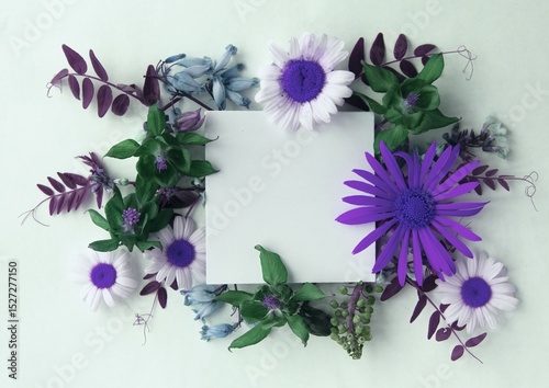 Flower arrangement with wildflowers and card on a white background