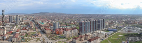 Aerial view of the city of Grozny in Chechnya. View of the city in the North Caucasus. Residential areas and the movement of cars through the streets of a big city.