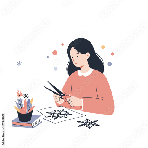 Girl cutting paper snowflakes while sitting at a table with supplies  