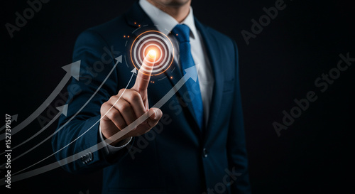 A businessman in a suit pointing to a target with upward trending arrows on a dark background image business.selling ,purchasing,agreement 
