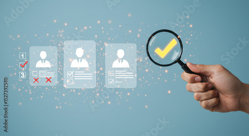 Hand holding magnifying glass over a profile with a checkmark indicating successful candidate search business.selling ,purchasing,agreement 