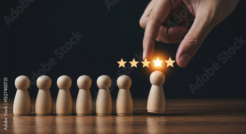 Hand giving five star rating to wooden figure on a wooden surface with a dark background in the image business.selling ,purchasing,agreement 