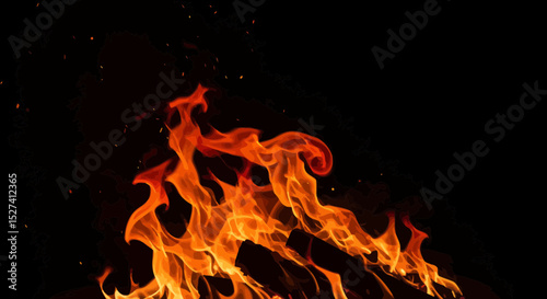 Intense flames dancing against a dark backdrop in a mesmerizing display