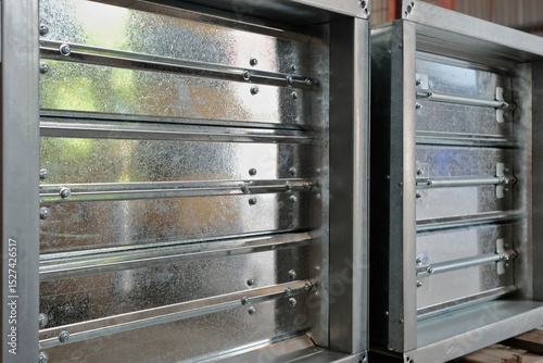 Close-up shot of flaps of fire damper.	
