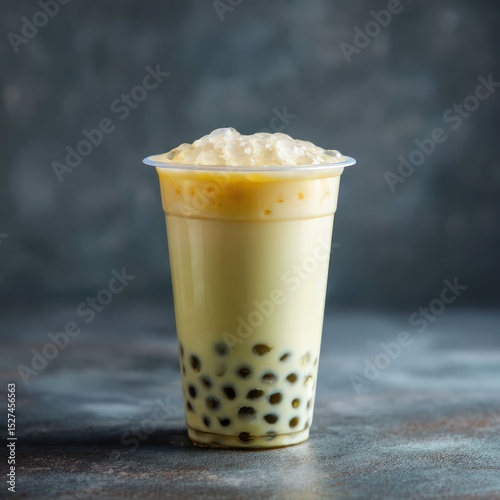 Simple honeydew milk tea with boba pearls, served in a clear cup for a refreshing sip.