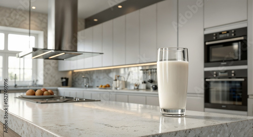 Glass of Milkshake on a Modern Kitchen Countertop represents the concept of modern kitchen design and the comfort of home living.