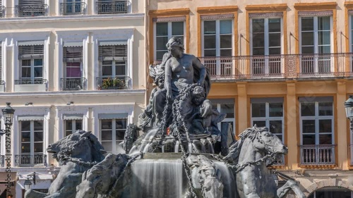 Hyperlapse of the Bartholdi Fountain, a symbol of Lyon, located on Place des Terreaux near City Hall. Equestrian sculpture with flowing water, surrounded by historic architecture timelapse. France