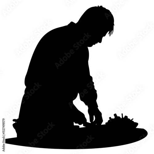 Silhouette of person chopping vegetables in kitchen, culinary passion