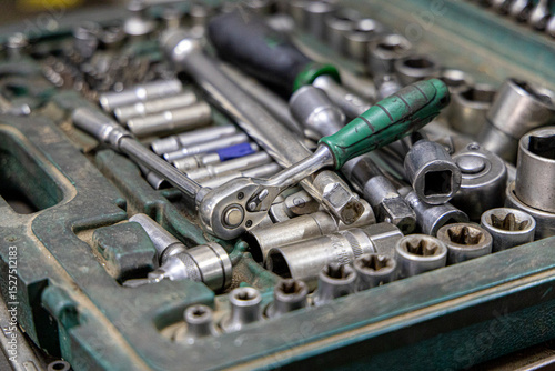 Closeup photo shoot of different nesessary tools and parts in every man's garage.Auto check up and car service shop concept.Different type of tools, especially wrenches.