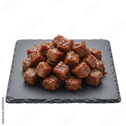Savory beef cubes arranged on a slate platter, highlighting their rich color and texture