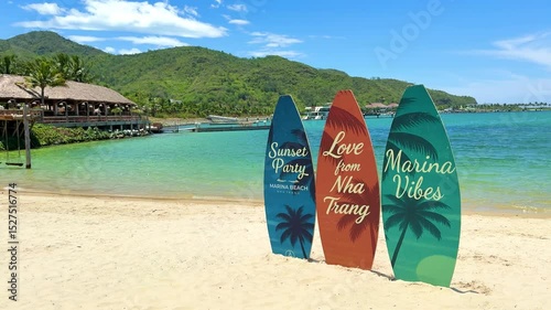 Vietnam, Nha Trang - 3.06.2025 - on the beach are surfboards and sap boards, sea sports for tourists, white sand and blue ocean, installation for surf club
