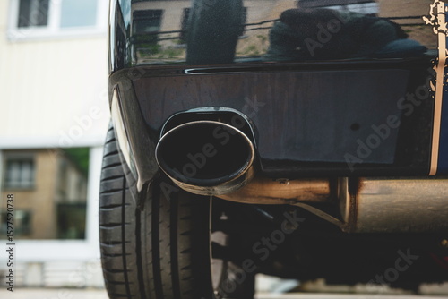 Wallpaper Mural Single tip, chromed car exhaust tail pipe close up shot. Low angle, no people Torontodigital.ca
