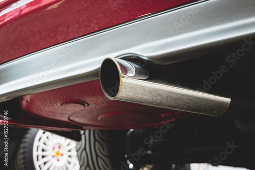Wallpaper Mural Single tip, chromed car exhaust tail pipe close up shot. Low angle, no people Torontodigital.ca