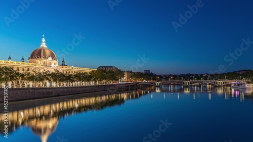 The Grand Hotel-Dieu Day to night timelapse hyperlapse in Lyon, France. This historic building now a luxury shopping destination, features illuminated domes and courtyards reflected in the Rhone River