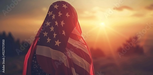 A Muslim girl in hijab stands in front of American flag