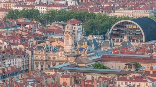 Aerial timelapse of Hotel de Ville de Lyon, the historic city hall of Lyon, France. Historic center with red roofs from above. A baroque and classical architectural marvel under a blue sky