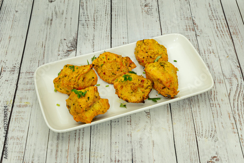 Served on skewers, often accompanied by flatbread (lavash), rice, salad, and sauces.