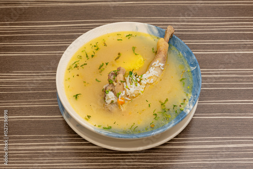 It is often served with pieces of meat or with grains of rice or barley, pasta, carrots, yellow potatoes, celery, white onion