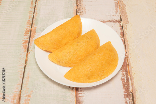Venezuelan empanadas are another culinary gem, made with precooked corn flour and fried until crispy.