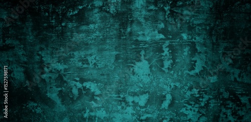A textured background featuring a deep teal color with a distressed, grunge appearance. The surface shows variations in tone and subtle patterns, creating an abstract and moody aesthetic.