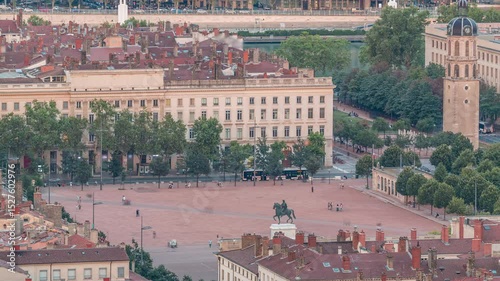Aerial timelapse of Place Bellecour from Fourviere Hill in Lyon, France, the largest pedestrian square in Europe. Featuring the equestrian statue of King Louis XIV surrounded by historic buildings