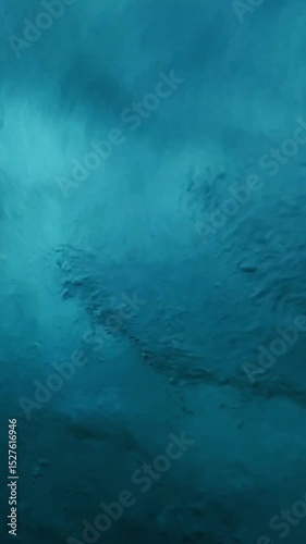 Underwater view of surfboard riding a wave in Indian Ocean. Low angle wide view vertical video of crashing wave