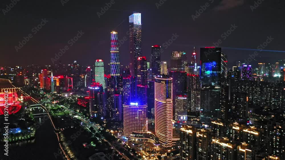 Guangzhou anniversary celebration features dazzling building light show display over the city skyline at night
