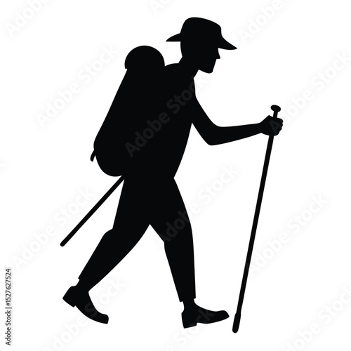 Silhouette of a Hiker with Backpack and Walking Stick in Action
