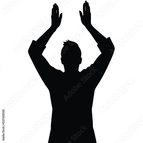 Silhouette of Man with Hands Raised Above Head in a Gesture of Celebration
