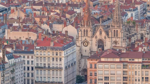 Aerial timelapse of the Church of Saint-Nizier in the Presqu'ile district of Lyon, France. A historic Gothic church with ornate details, known as the Church of Holy Apostles, showcasing its facade