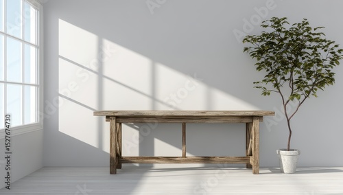 Simple, bright room with rustic table and plant