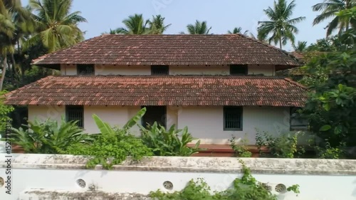 Exploring Traditional House with Tiled Roof in Tropical Setting