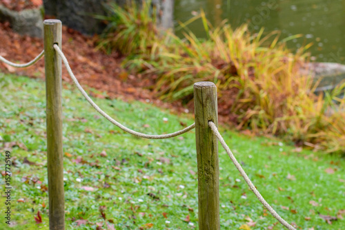 Wooden stakes and rope are a simple way to fence in the garden