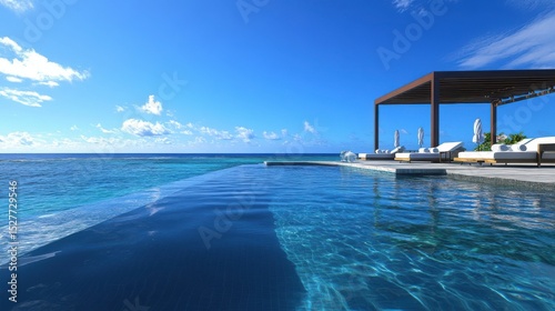Infinity pool overlooking a pristine beach, cabanas and tropical drinks nearby, pure indulgence and summer relaxation photo