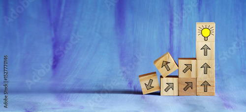 Business growth,success,teamwork, concept,wooden cubes with arrows and lightbulb for planning development,ideas,innovation,leadership,free copy space. 
