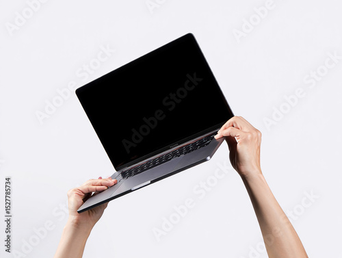 Hands Holding Up a Modern Laptop with Blank Screen